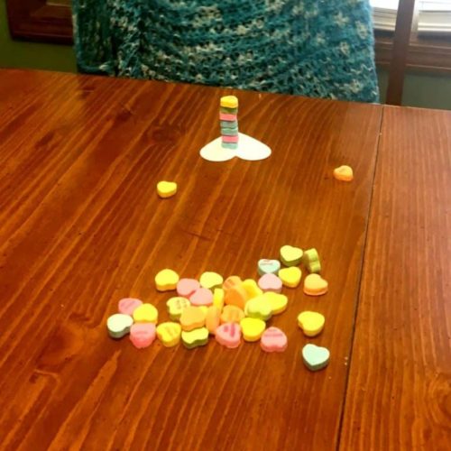 Preschool Valetine's Day games and activities. Perfect for toddlers, kindergartners, and preschoolers in the classroom. Includes BINGO, minute to win it, and tic tac toe with free printables! #gamesforkids #toddleractivities #valentinesdayactivities #preschoolers #activitiesforkids #preschoolactivities