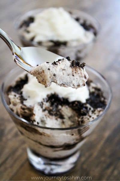Pouring Cookies and Cream Sauce on Mousse