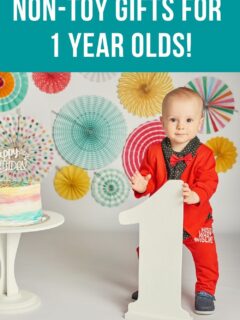 1 year old standing in front of the number 1
